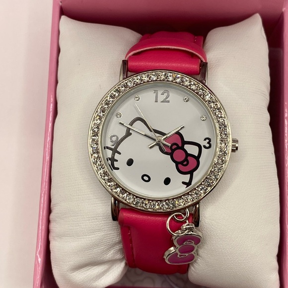 Hello Kitty Accessories - Hello Kitty silver/pink watch with rhinestone accents and dangle bow charm NWT